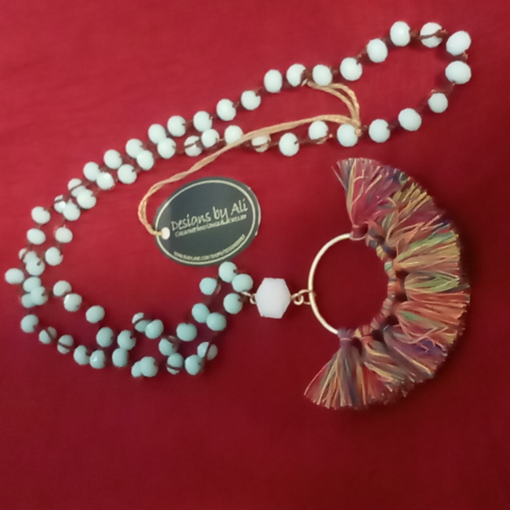 Ruby lane designed by ALI .String  Beaded baby blue .Beautiful tassel necklace